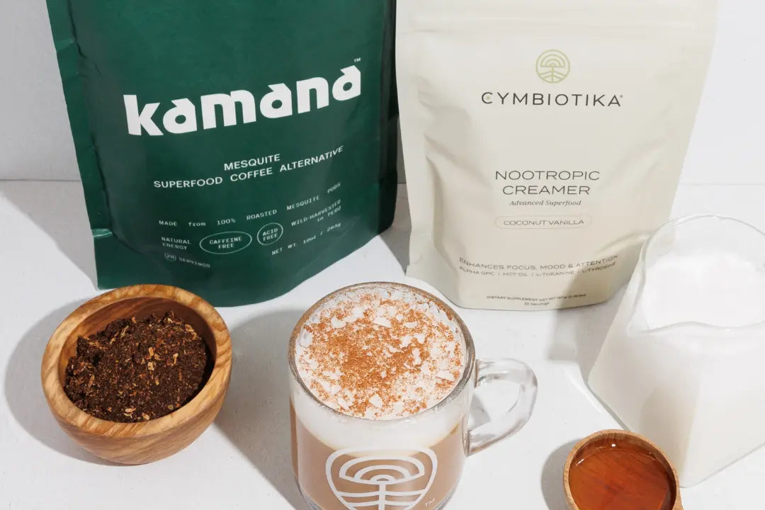 Mesquite coffee latte made with Kamana superfood coffee alternative and nootropic creamer, surrounded by ingredients on a white surface